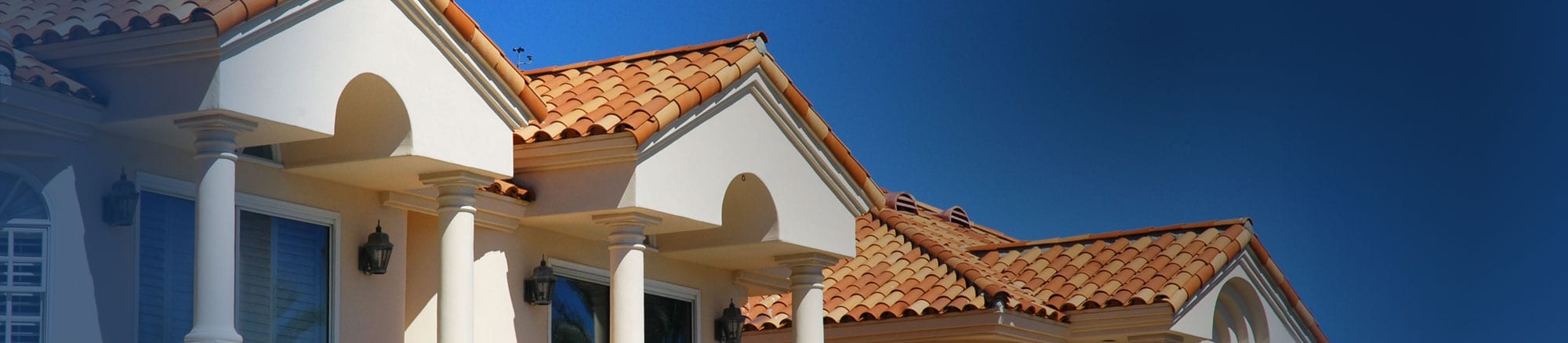New home with shingle roofing and white pillars